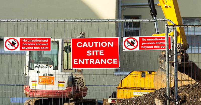 Fencing around a construction site that is preventing theft of construction equipment