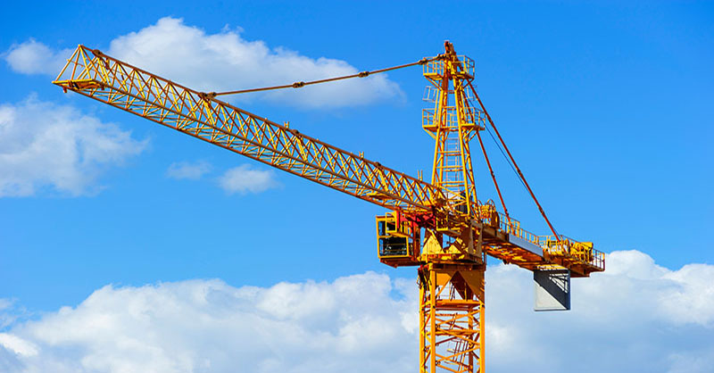 Yellow Crane with blue sky in background