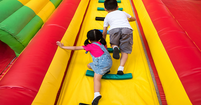 Kids going up an Inflatable slide