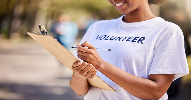 Volunteer holding a clipboard