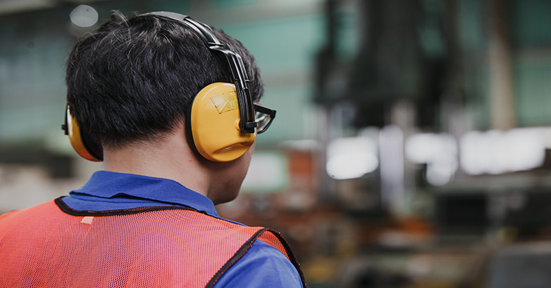 Worker wearing headphones