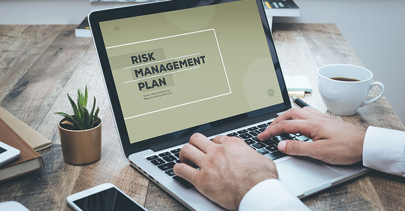 Laptop with the words Risk Management on the screen
